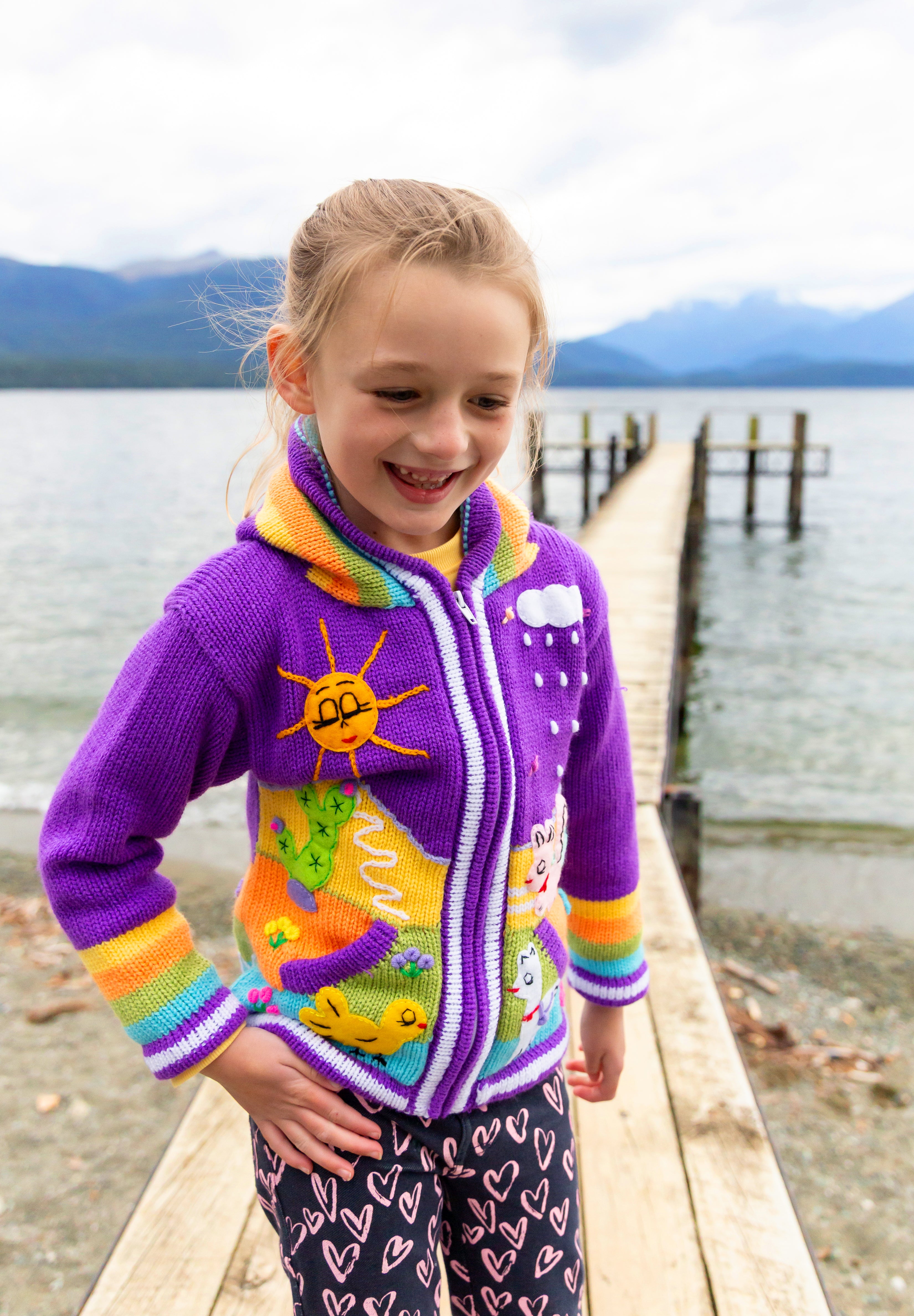 Child wearing handmade Peruvian jumper ages 7-8, Fiordland New Zealand
