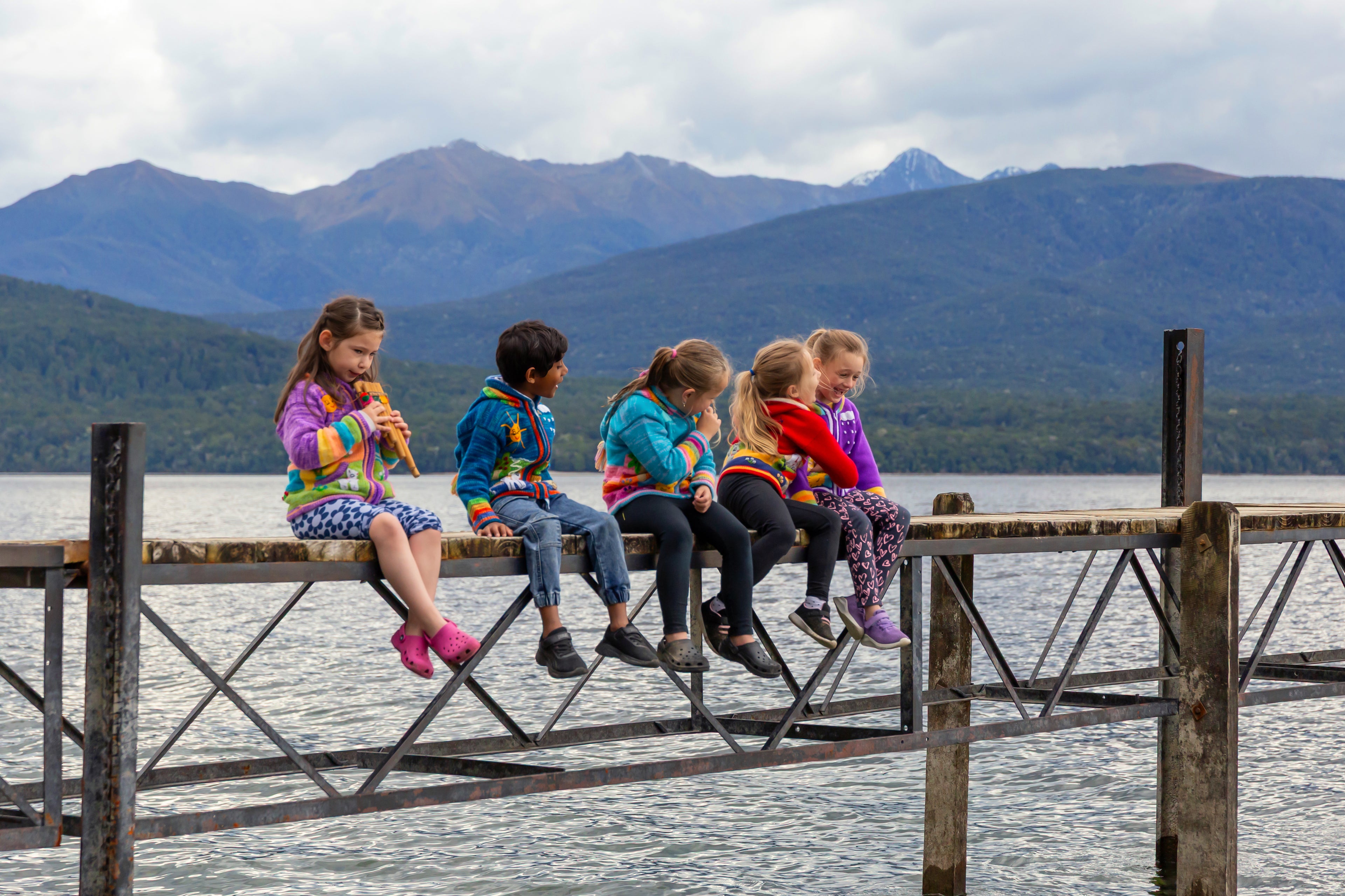 Child wearing handmade Peruvian jumper ages 7-8, Fiordland New Zealand